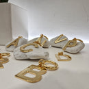 LETTERE ciondolo color oro