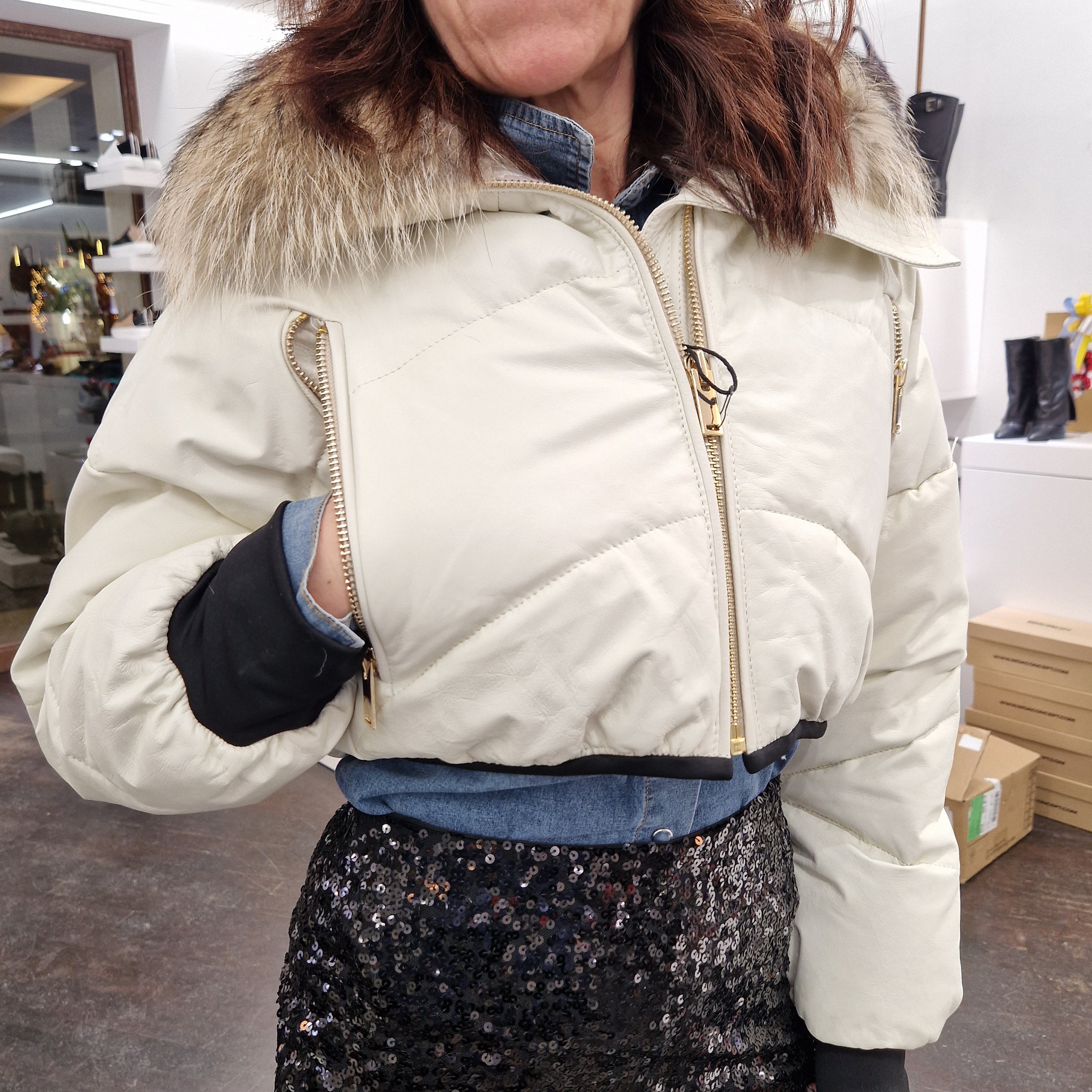 Piumino in pelle con  collo in real fur