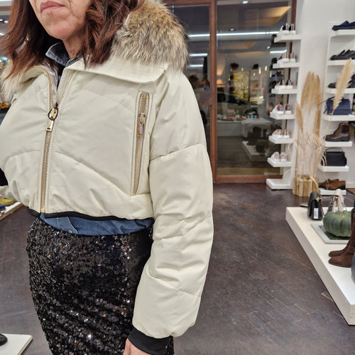 Piumino in pelle con  collo in real fur