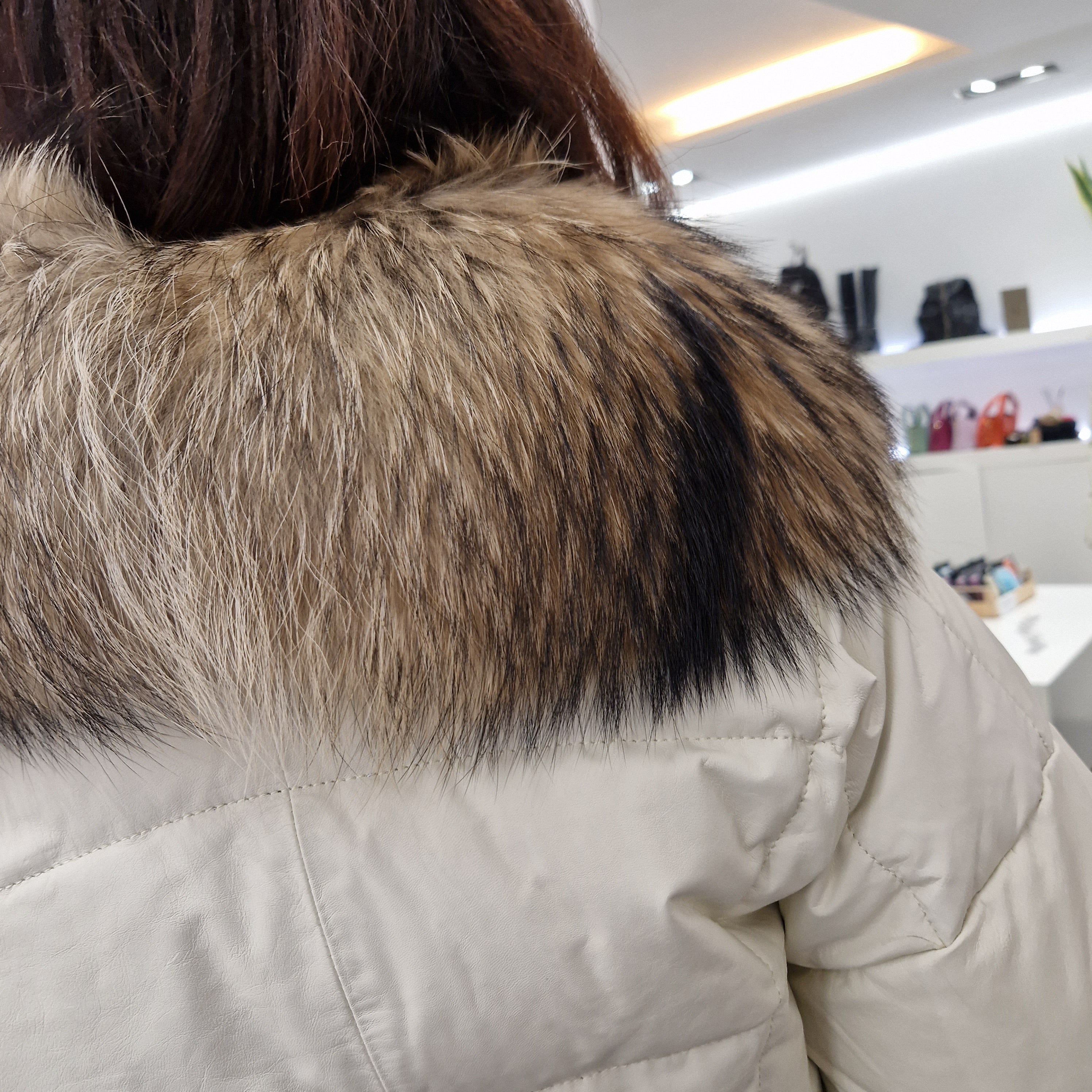 Piumino in pelle con  collo in real fur