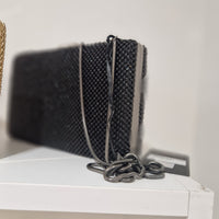 Borsa pochette in metallo  e strass modello ALAIA
