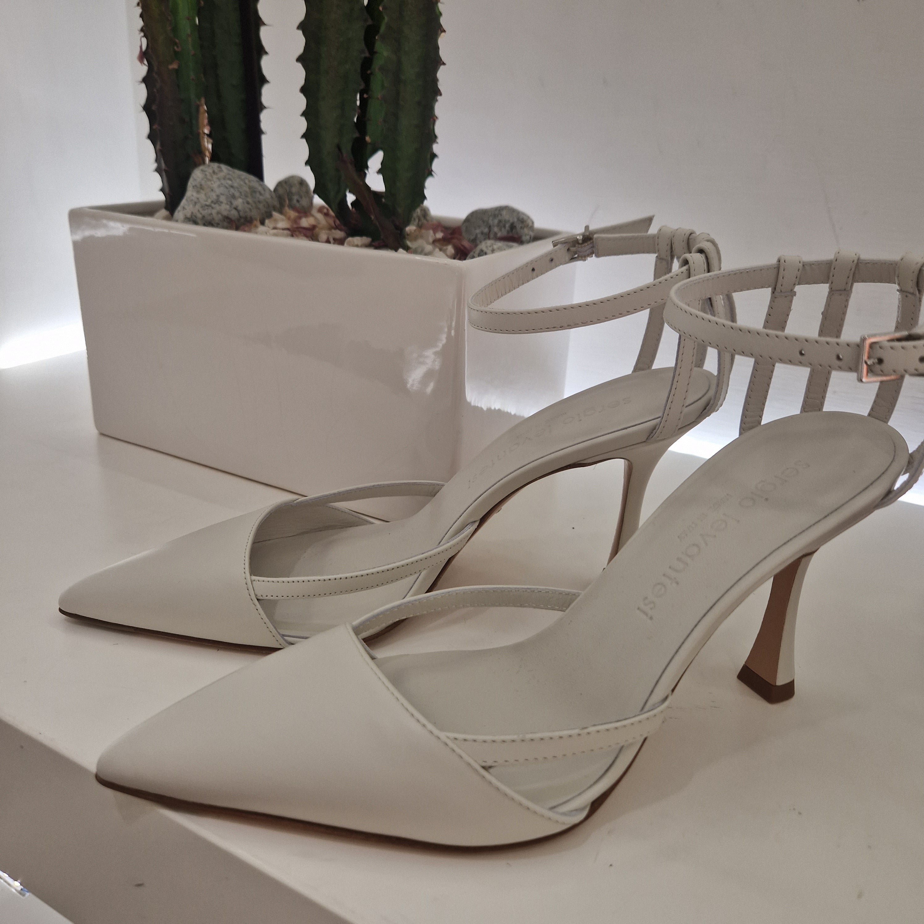 Sergio Levantesi open at the sides cream colored leather