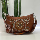 Campomaggi borsa linea TERESA accessorio medaglie e rivetti oro