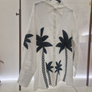 Camicia con palme ricamate