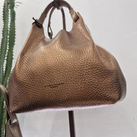 Gianni Chiarini  linea DUA formato medio pellame laminato