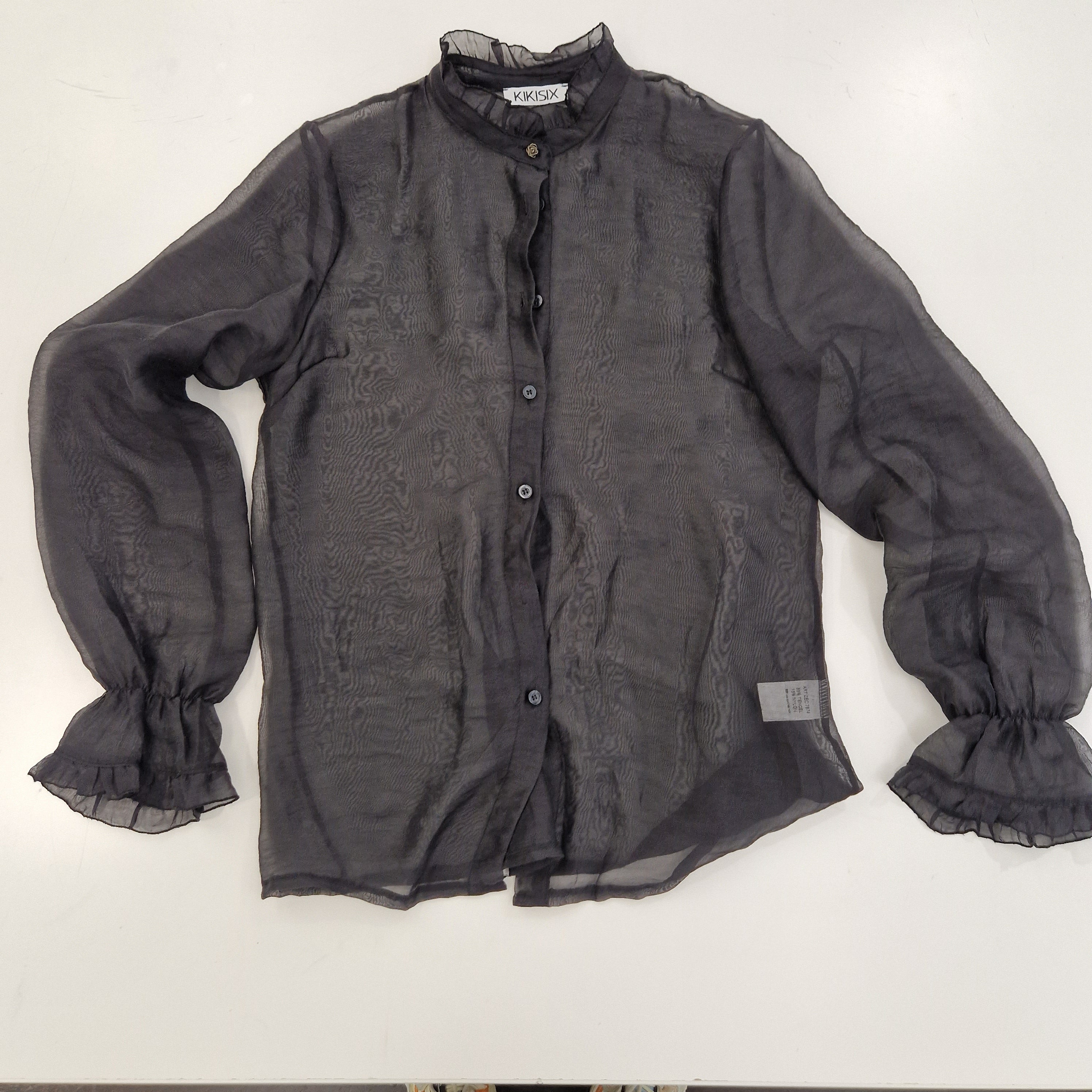 Kikisix camicia trasoarente nera POLLY con rouge sulla manica